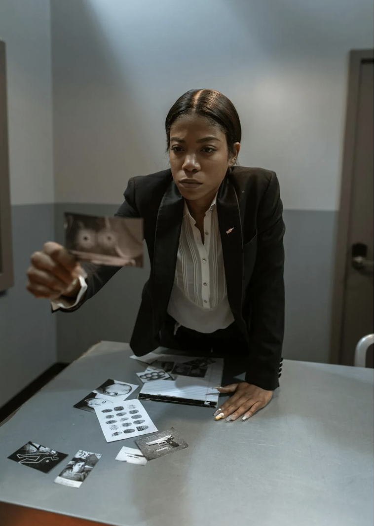 An image of a woman holding a photograph