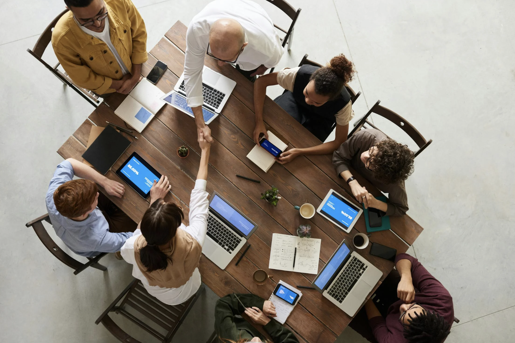 People working on laptops at a table