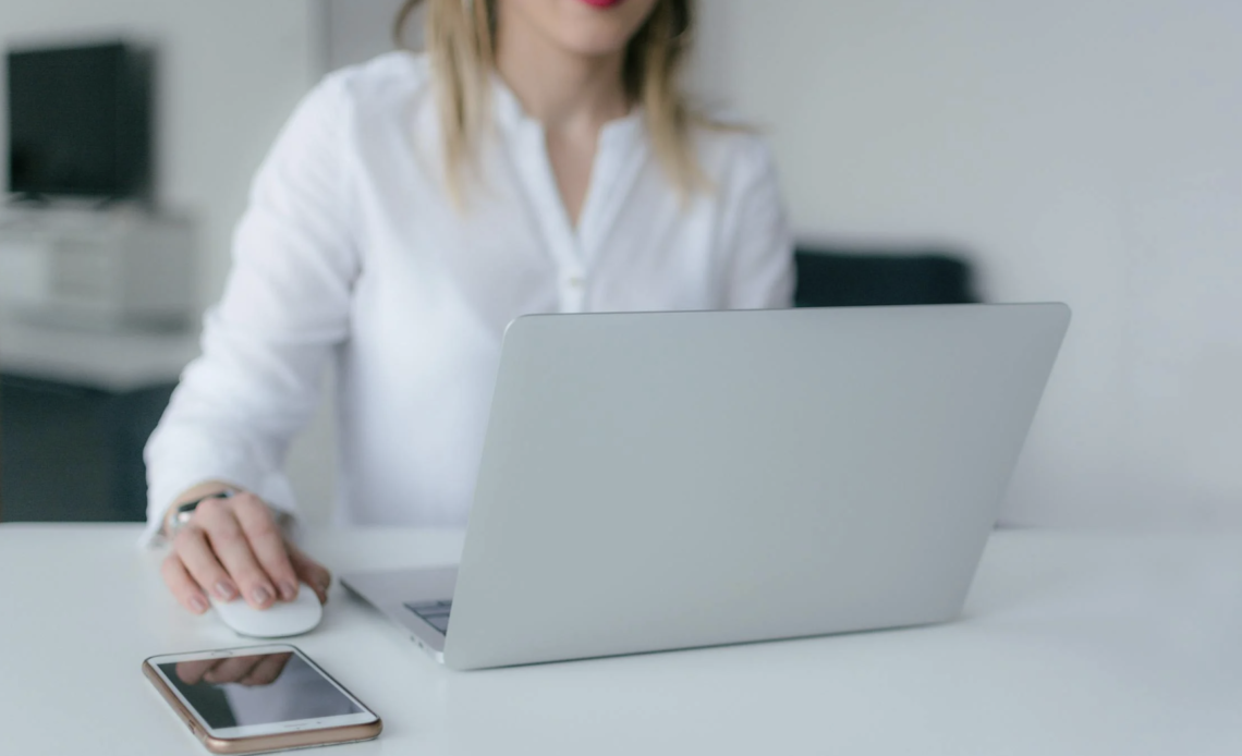 Woman intently working on her laptop